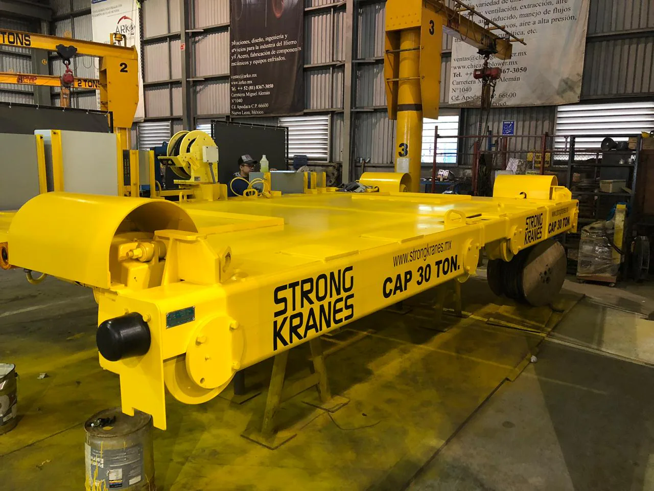 Yellow 30-ton Strong Kranes transfer car inside an industrial workshop